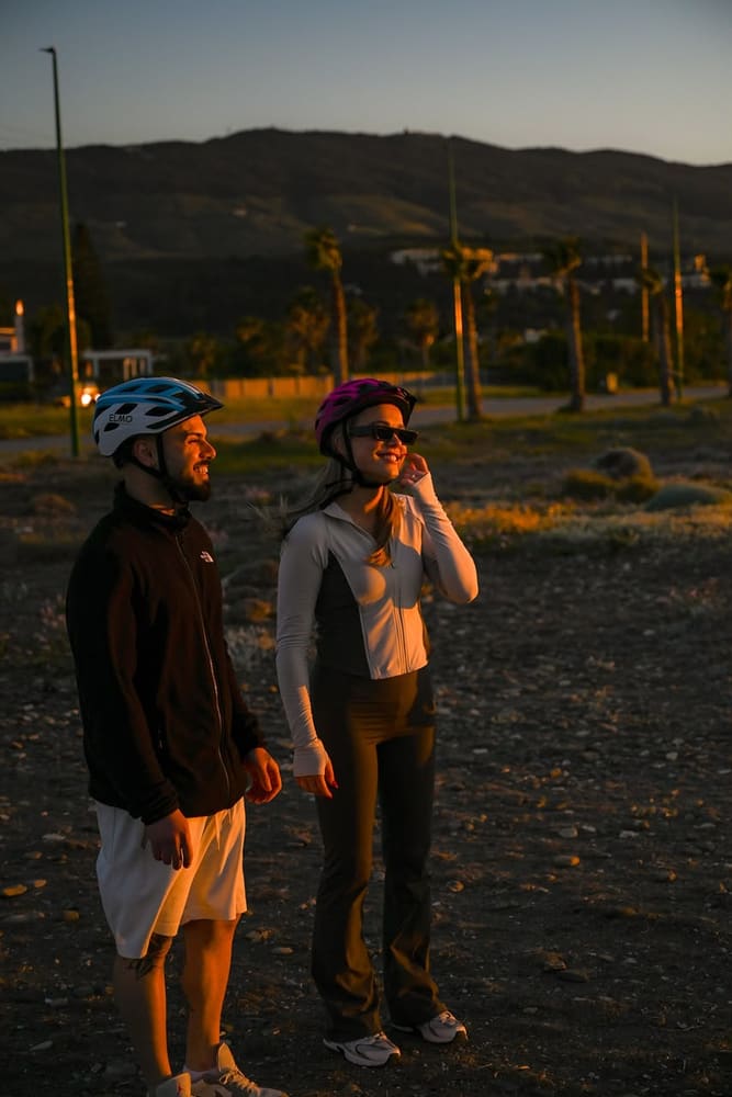 Riders watching the sunset over Kos