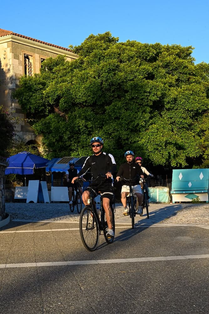 Riders passing the Hippocrates Tree